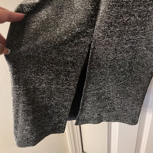 Mid length stretch black shimmery prom dress with slit in back size 4 never worn - Picture 3 of 5